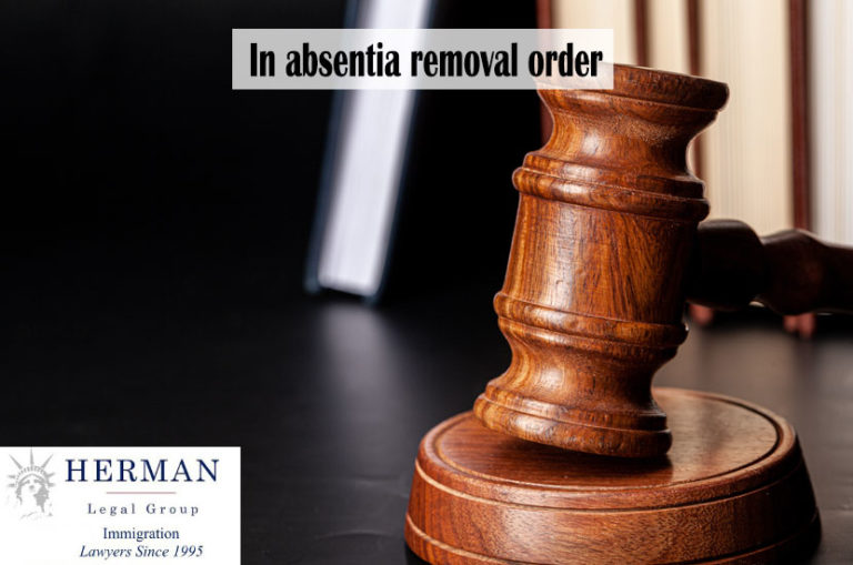 Wooden gavel and juridical books close up