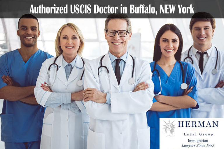 Successful team of medical doctors are looking at camera and smiling while standing in hospital