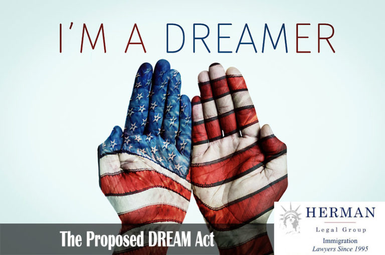 The hands of a man put together patterned as the flag of the United States and the text I am a dreamer, for the beneficiaries of the Dream Act, on a pale blue background