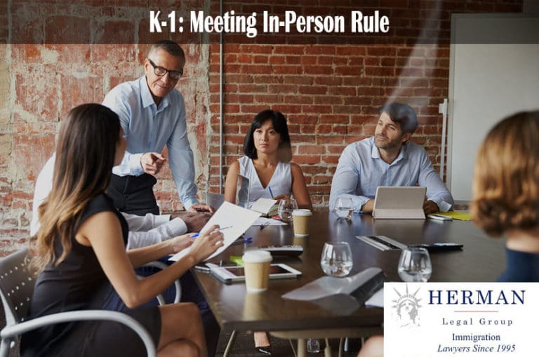 Businesspeople Meeting In Modern Boardroom Through Glass