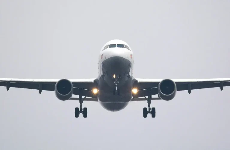 Front view of a commercial airplane in sky