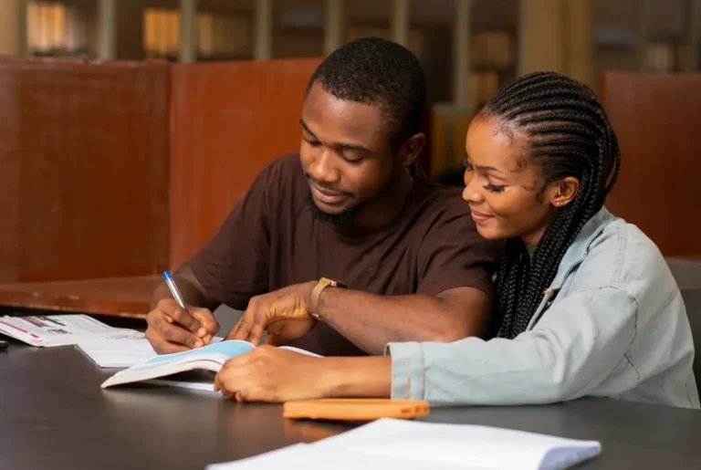 Couple reviewing documents together at a table