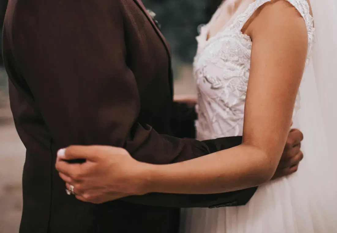 Bride and groom embracing on their wedding day